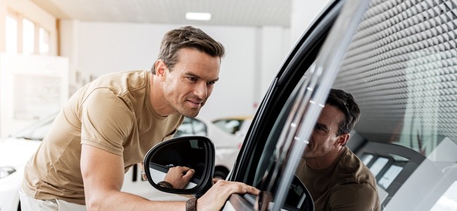 Man-Inspecting-Car
