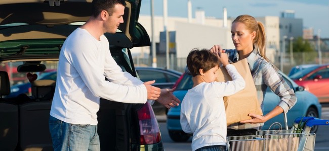 Family-Loading-Groceries-Into-Car