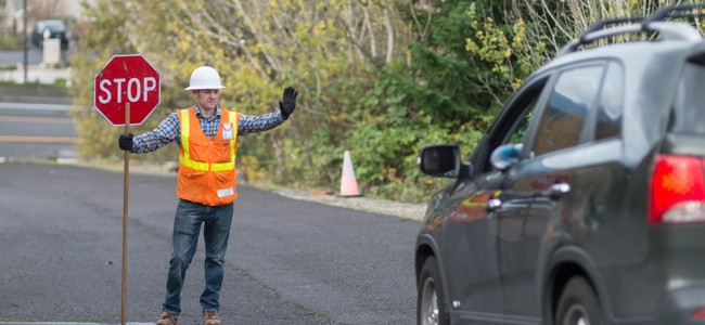 Construction-Worker-Holding-Stop-Sign