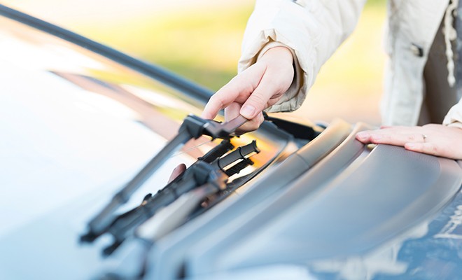 Driver-Checking-Windshield-Wiper