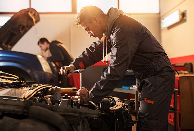 Mechanic-Working-On-Vehicle