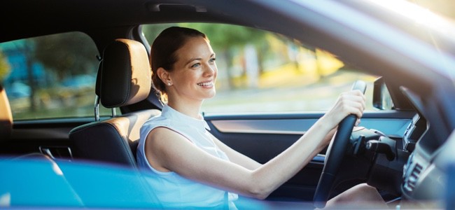 Female-Driver-With-Hands-On-Wheel