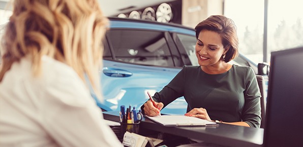 Customer-Signing-Paperwork-at-Garage