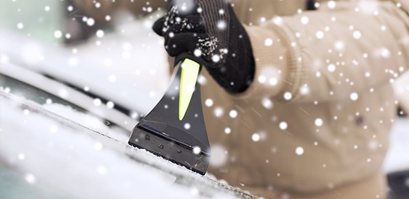 Driver-Scraping-Car-Windshield