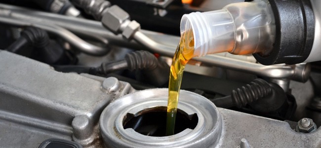 Adding-Oil-To-Car-Engine